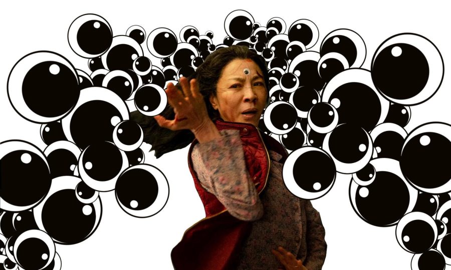 Woman in red vest and googly eye on forehand extends hand outward, surrounded by eyes in the background.