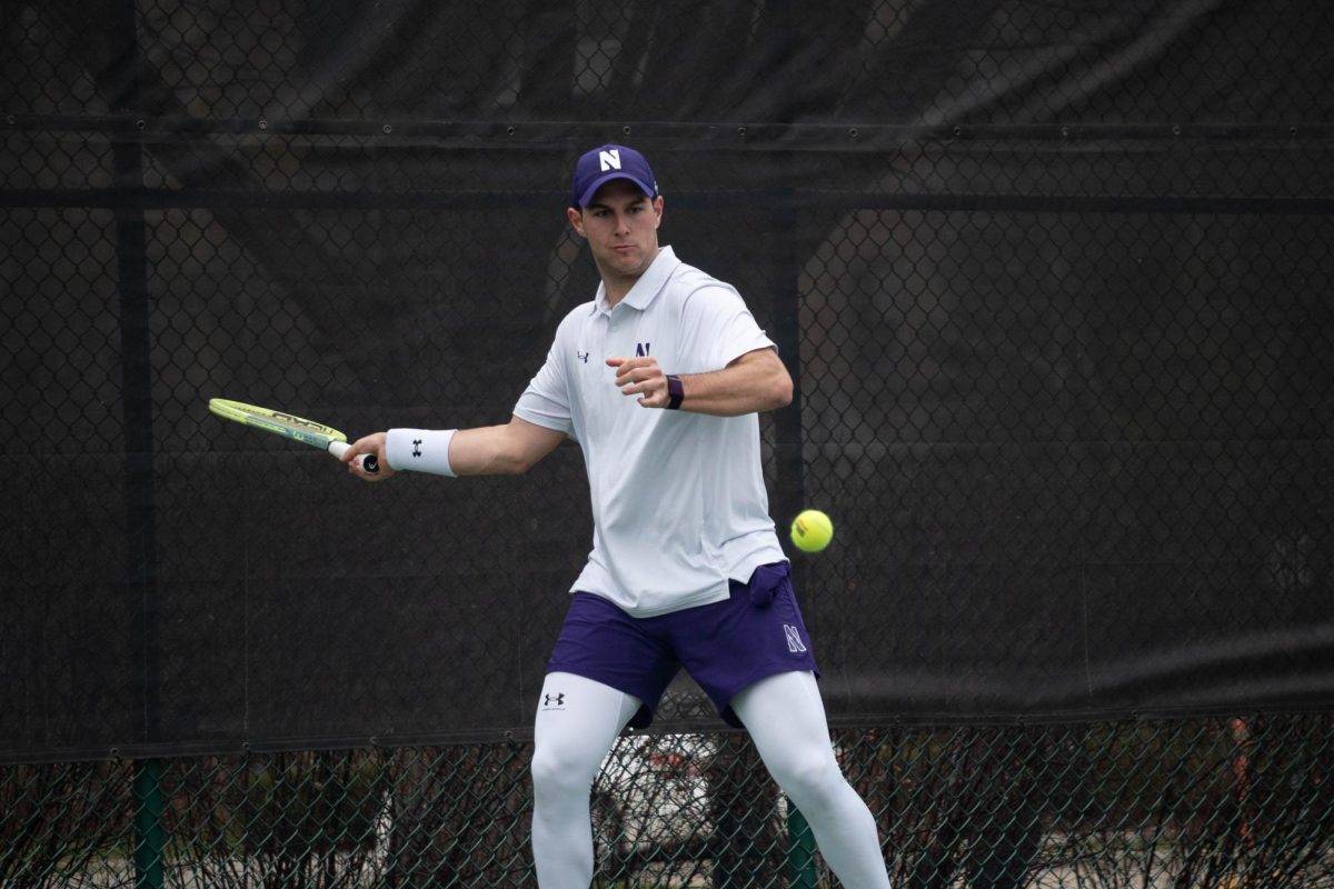 Junior Chad Miller swings a forehand last weekend against Ohio State. Miller earned Northwestern’s lone point of the weekend with his 6-4, 6-4 singles win at Oregon.